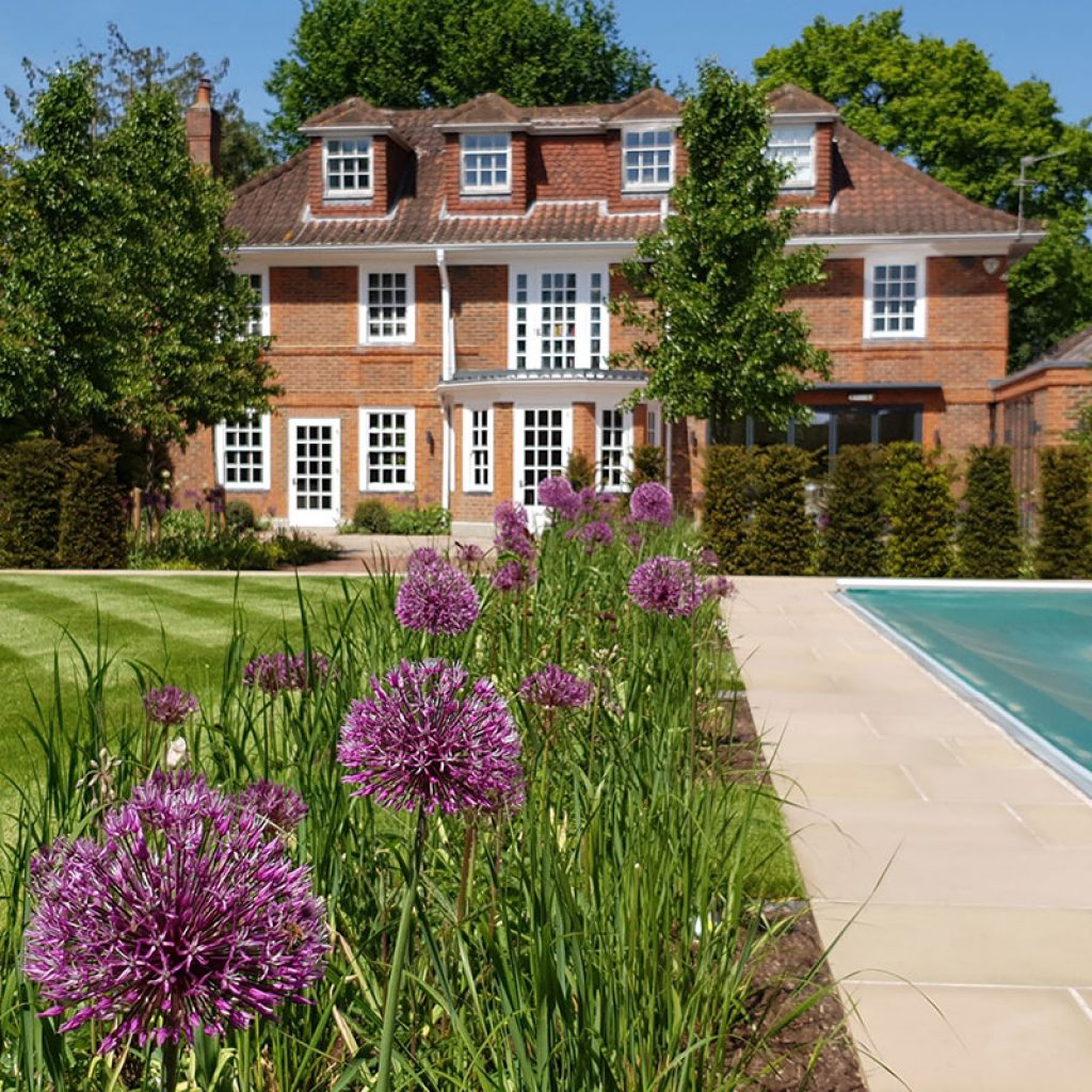 Traditional garden planting surrounds this beautiful property.